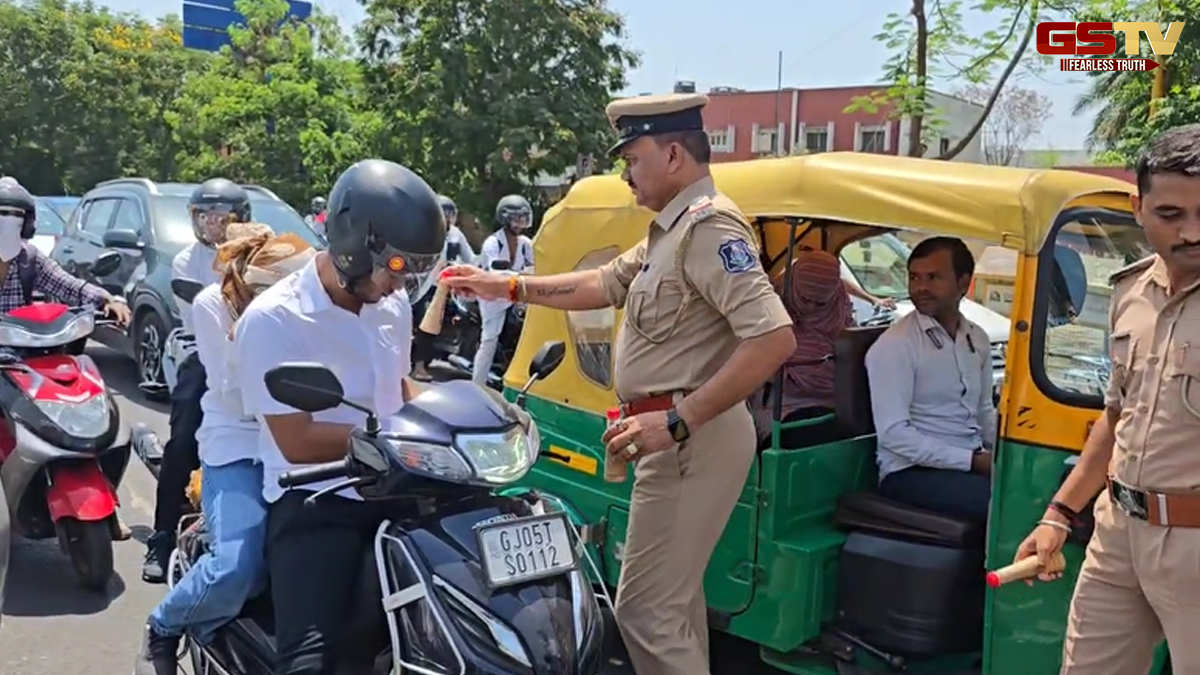 ગુજરાતમાં ગરમીથી રાહત મેળવવા લોકોની અવનવી પ્રવૃત્તિ, Surat Traffic Policeની ખાસ પહેલ